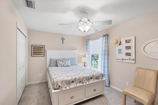4225 Fairway Dr, North Port, FL 34287 - bedroom with light carpet, baseboards, a closet, and a ceiling fan