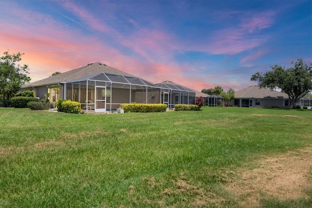 4225 Fairway Dr, North Port, FL 34287 - back of house featuring a yard and a lanai