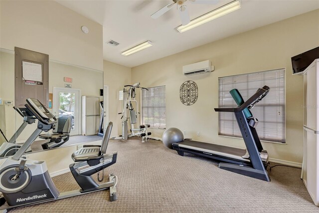 4225 Fairway Dr, North Port, FL 34287 - exercise room with an AC wall unit, carpet flooring, ceiling fan, and baseboards