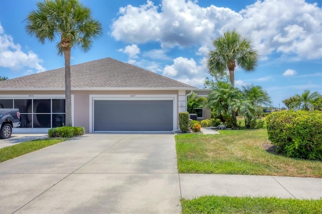 4225 Fairway Dr, North Port, FL 34287 - single story home with stucco siding, driveway, a front yard, a garage, and a shingled roof