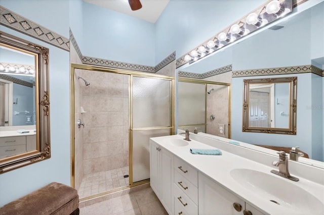 4225 Fairway Dr, North Port, FL 34287 - full bath featuring a stall shower, double vanity, tile patterned floors, and ceiling fan