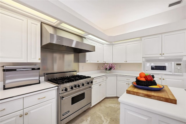 8500 Manasota Key Rd, Englewood, FL 34223 - kitchen featuring premium stove, wall chimney exhaust hood, white microwave, and light countertops