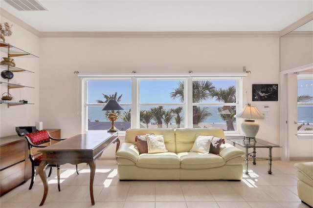 8500 Manasota Key Rd, Englewood, FL 34223 - living room with healthy amount of natural light, light tile patterned floors, and ornamental molding
