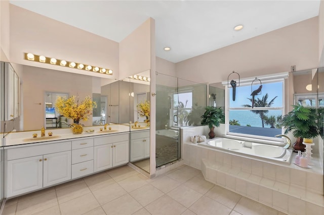 8500 Manasota Key Rd, Englewood, FL 34223 - bathroom with a garden tub, double vanity, tile patterned flooring, a stall shower, and recessed lighting