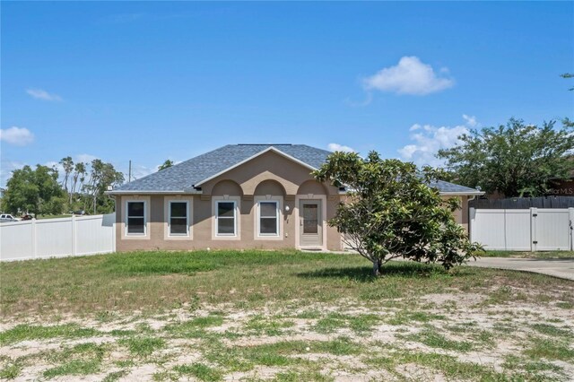 5510 Moongate Rd, Spring Hill, FL 34606 - view of front of house featuring stucco siding, a gate, and concrete driveway