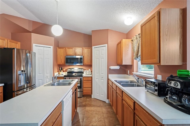 5510 Moongate Rd, Spring Hill, FL 34606 - kitchen with stainless steel appliances, a sink, light countertops, lofted ceiling, and a textured ceiling