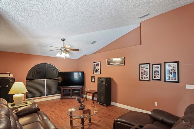 5510 Moongate Rd, Spring Hill, FL 34606 - living area with ceiling fan, a textured ceiling, wood finished floors, vaulted ceiling, and baseboards