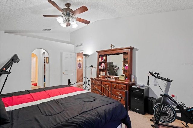 5510 Moongate Rd, Spring Hill, FL 34606 - bedroom featuring lofted ceiling, arched walkways, light colored carpet, a textured ceiling, and a ceiling fan