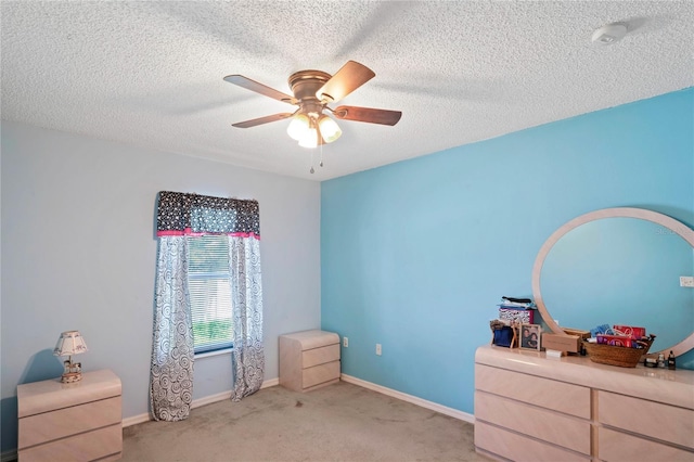 5510 Moongate Rd, Spring Hill, FL 34606 - unfurnished bedroom with carpet, a textured ceiling, a ceiling fan, and baseboards