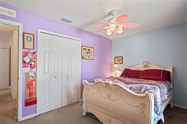 5510 Moongate Rd, Spring Hill, FL 34606 - bedroom featuring carpet floors, a closet, a textured ceiling, a ceiling fan, and baseboards