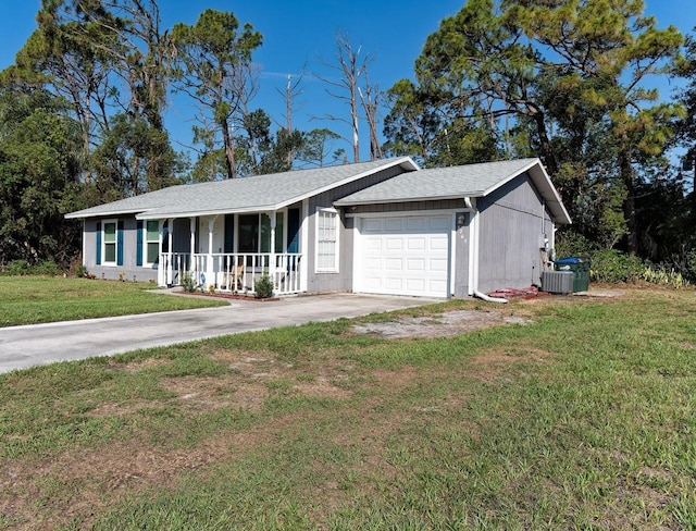 3261 Rogue St, North Port, FL 34291 - ranch-style house with a porch, a garage, driveway, a front lawn, and central AC