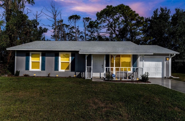 3261 Rogue St, North Port, FL 34291 - ranch-style house with a porch, a garage, a lawn, concrete driveway, and a shingled roof