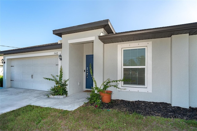 2408 Bonanza Ln, North Port, FL 34286 - view of front of home featuring an attached garage, stucco siding, and driveway