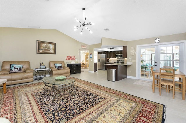 209 Fairway Rd, Rotonda West, FL 33947 - living room with a chandelier, lofted ceiling, french doors, light tile patterned floors, and baseboards