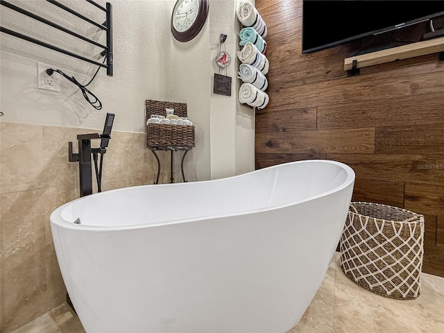 209 Fairway Rd, Rotonda West, FL 33947 - full bath featuring wood walls, a freestanding tub, and tile walls