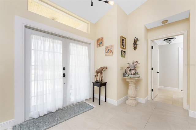 209 Fairway Rd, Rotonda West, FL 33947 - foyer entrance featuring lofted ceiling and baseboards