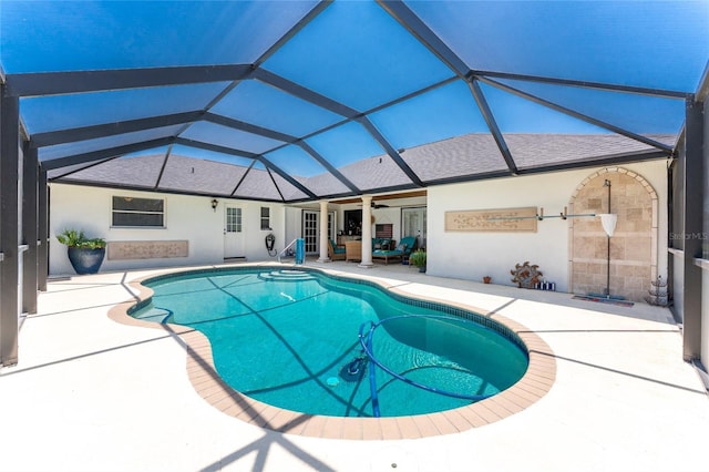 209 Fairway Rd, Rotonda West, FL 33947 - swimming pool featuring a patio area, a ceiling fan, outdoor lounge area, and glass enclosure
