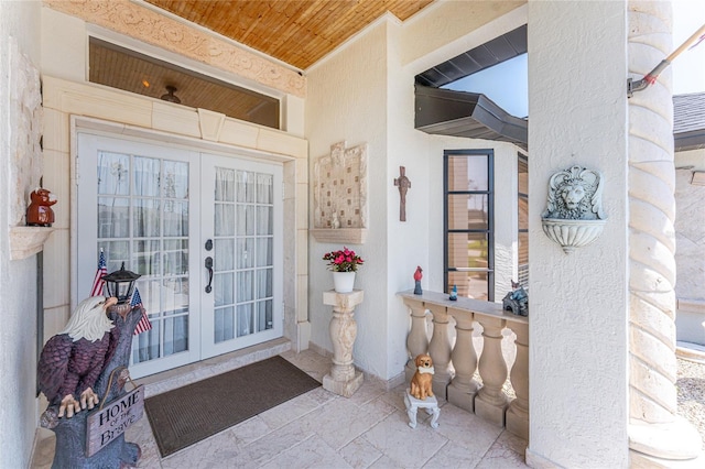 209 Fairway Rd, Rotonda West, FL 33947 - entrance to property featuring french doors and stucco siding