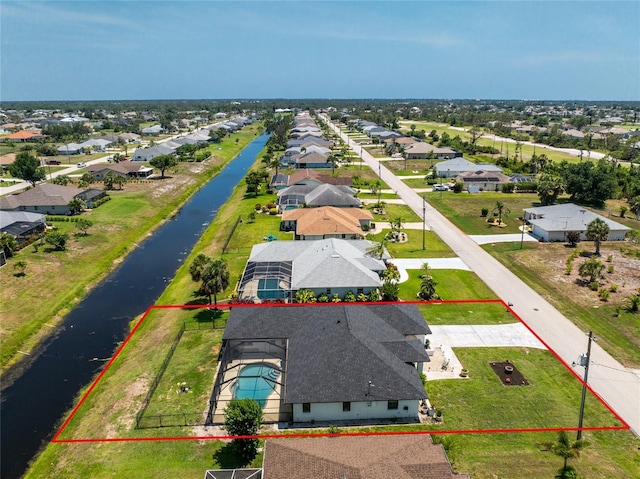209 Fairway Rd, Rotonda West, FL 33947 - aerial perspective of suburban area with property parcel outlined and a large body of water