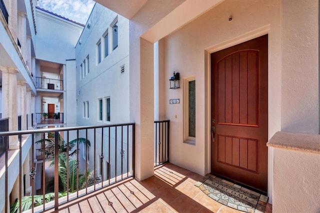 11100 Hacienda Del Mar Blvd Unit G-304, Placida, FL 33946 - property entrance with stucco siding and a balcony