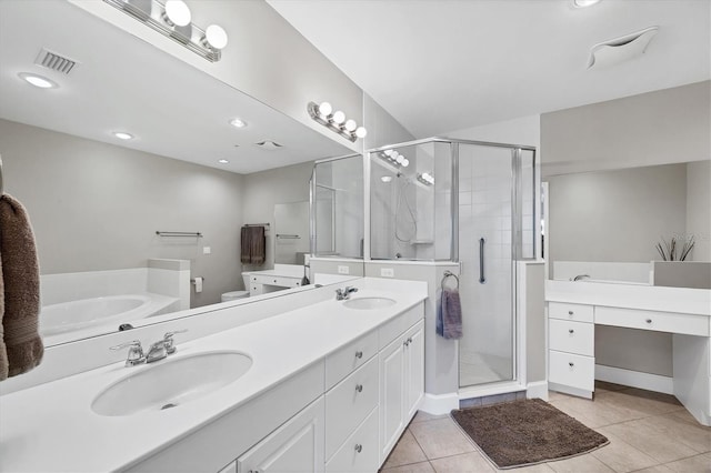 11100 Hacienda Del Mar Blvd Unit G-304, Placida, FL 33946 - full bath featuring double vanity, a stall shower, a bath, and tile patterned flooring