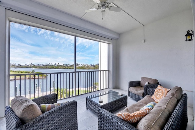 11100 Hacienda Del Mar Blvd Unit G-304, Placida, FL 33946 - sunroom / solarium with a water view, an outdoor living space, and a ceiling fan