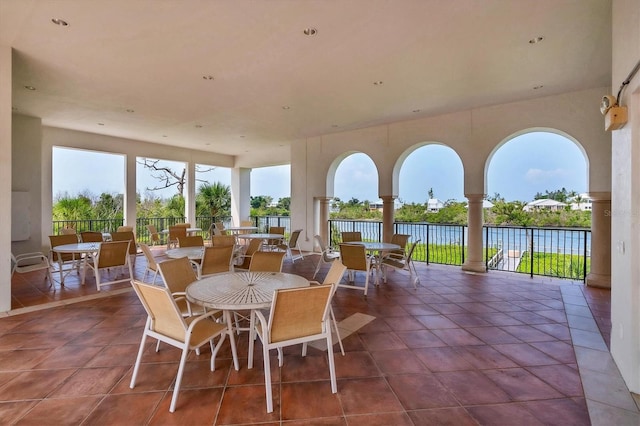 11100 Hacienda Del Mar Blvd Unit G-304, Placida, FL 33946 - view of patio / terrace with outdoor dining area and a water view