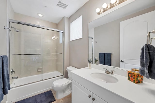 11100 Hacienda Del Mar Blvd Unit G-304, Placida, FL 33946 - full bathroom featuring toilet, vanity, shower / bath combination with glass door, and tile patterned floors