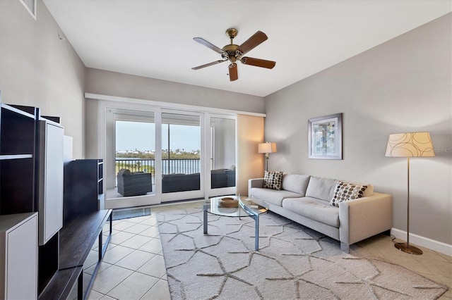11100 Hacienda Del Mar Blvd Unit G-304, Placida, FL 33946 - living room with tile patterned flooring, a ceiling fan, and baseboards