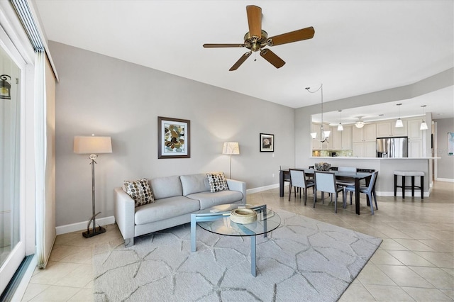 11100 Hacienda Del Mar Blvd Unit G-304, Placida, FL 33946 - living area with light tile patterned flooring, ceiling fan, and baseboards
