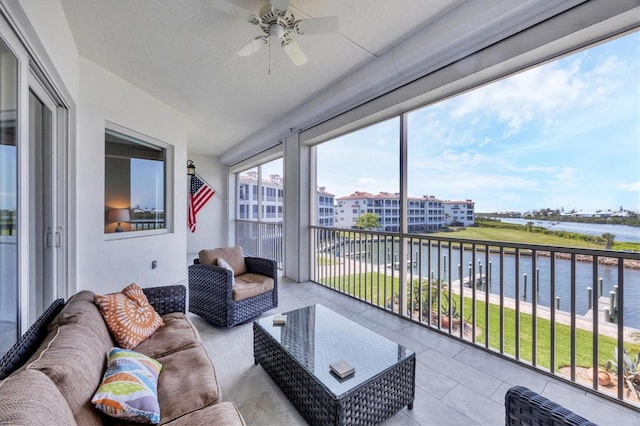11100 Hacienda Del Mar Blvd Unit G-304, Placida, FL 33946 - sunroom / solarium with a water view, tile patterned flooring, ceiling fan, vaulted ceiling, and outdoor lounge area
