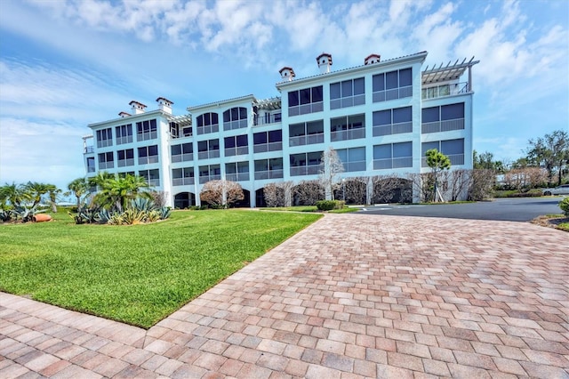 11100 Hacienda Del Mar Blvd Unit G-304, Placida, FL 33946 - view of building exterior featuring decorative driveway