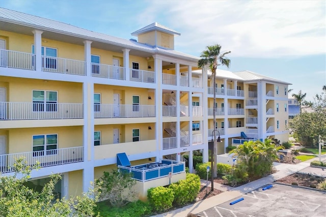 8411 Placida Rd Unit 404, Placida, FL 33946 - view of apartment building / complex featuring uncovered parking