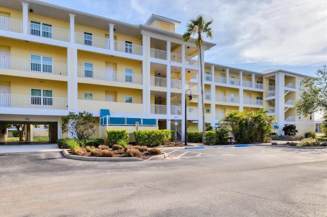 8411 Placida Rd Unit 404, Placida, FL 33946 - view of apartment building / complex featuring uncovered parking