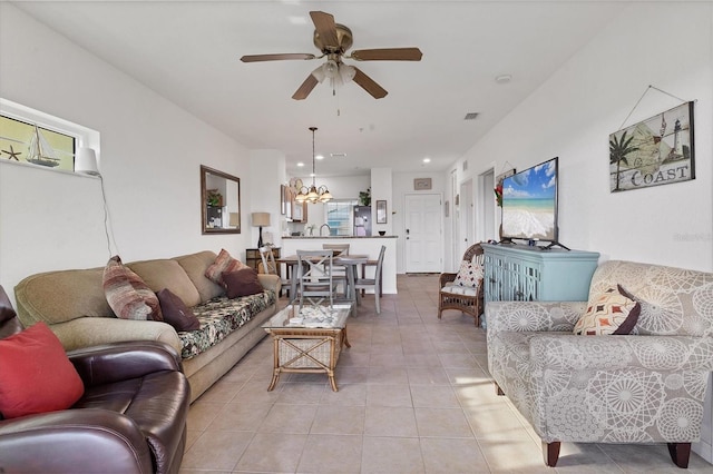 8411 Placida Rd Unit 404, Placida, FL 33946 - living area featuring light tile patterned floors, a ceiling fan, a chandelier, and recessed lighting