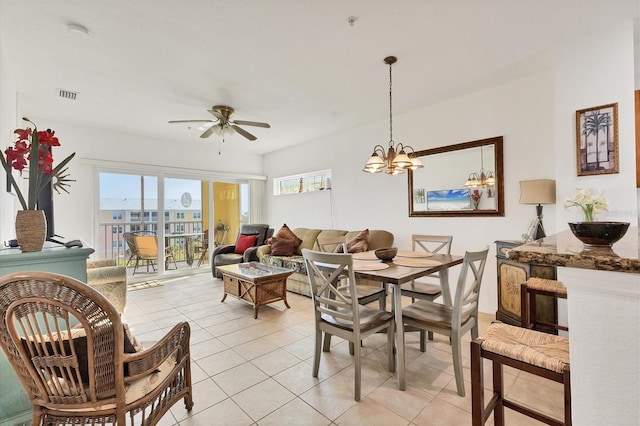 8411 Placida Rd Unit 404, Placida, FL 33946 - dining area featuring a ceiling fan, light tile patterned flooring, and a chandelier