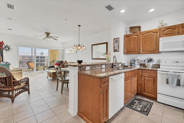 8411 Placida Rd Unit 404, Placida, FL 33946 - kitchen with white appliances, a sink, brown cabinets, ceiling fan, and recessed lighting