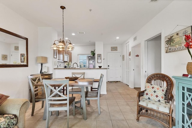 8411 Placida Rd Unit 404, Placida, FL 33946 - dining space with a chandelier, light tile patterned floors, and recessed lighting