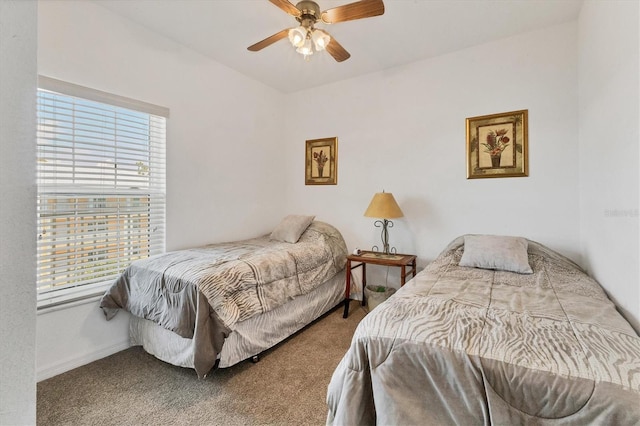 8411 Placida Rd Unit 404, Placida, FL 33946 - carpeted bedroom with multiple windows, baseboards, and a ceiling fan