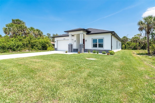 398 Sunset Rd N, Rotonda West, FL 33947 - prairie-style home with concrete driveway, stucco siding, an attached garage, and a front yard