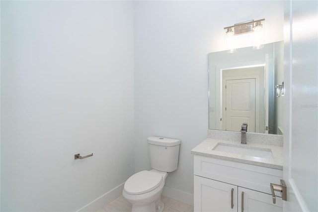 398 Sunset Rd N, Rotonda West, FL 33947 - half bathroom featuring vanity, toilet, baseboards, and tile patterned flooring