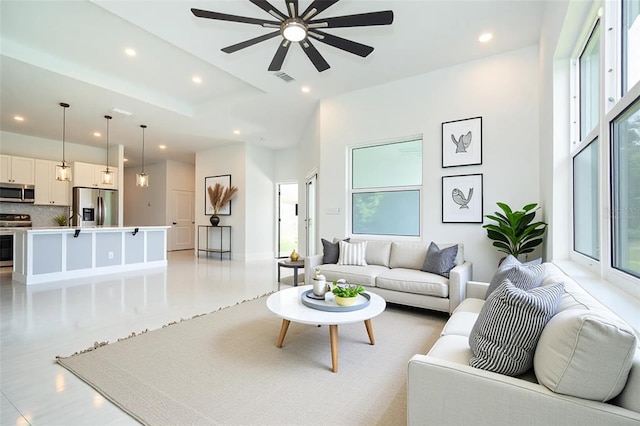 398 Sunset Rd N, Rotonda West, FL 33947 - living area with recessed lighting, a ceiling fan, and baseboards
