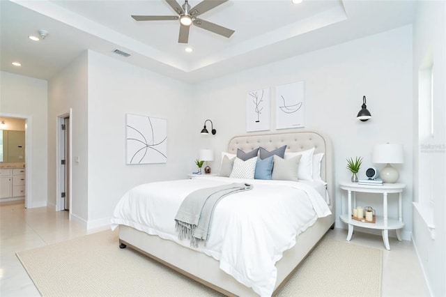 398 Sunset Rd N, Rotonda West, FL 33947 - bedroom with recessed lighting, a tray ceiling, baseboards, and light tile patterned flooring