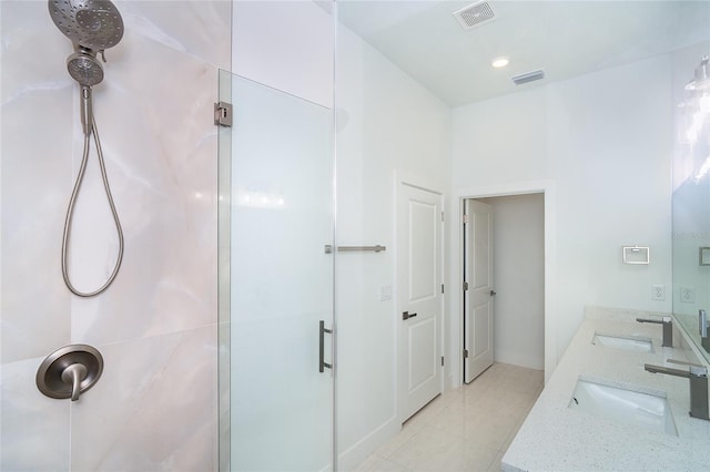 398 Sunset Rd N, Rotonda West, FL 33947 - bathroom featuring a shower stall, double vanity, and tile patterned floors
