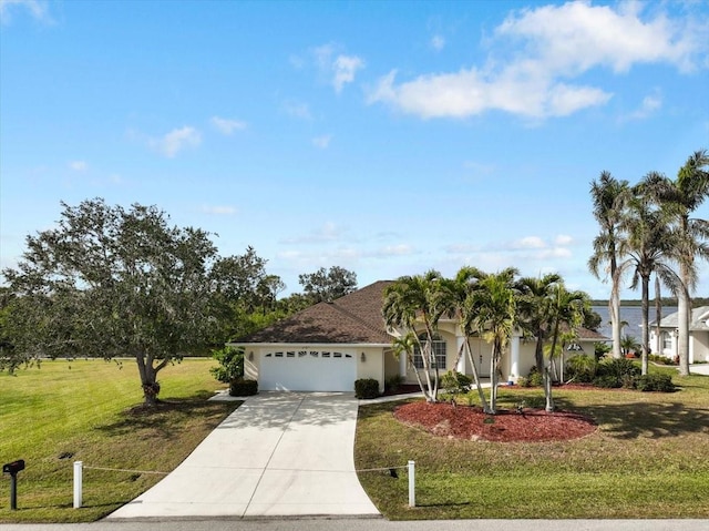 2295 Chilcote Ter, Port Charlotte, FL 33981 - view of front facade with an attached garage, driveway, and a front yard