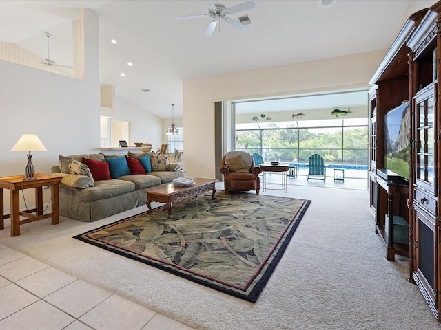 2295 Chilcote Ter, Port Charlotte, FL 33981 - carpeted living area featuring ceiling fan, lofted ceiling, tile patterned flooring, and recessed lighting