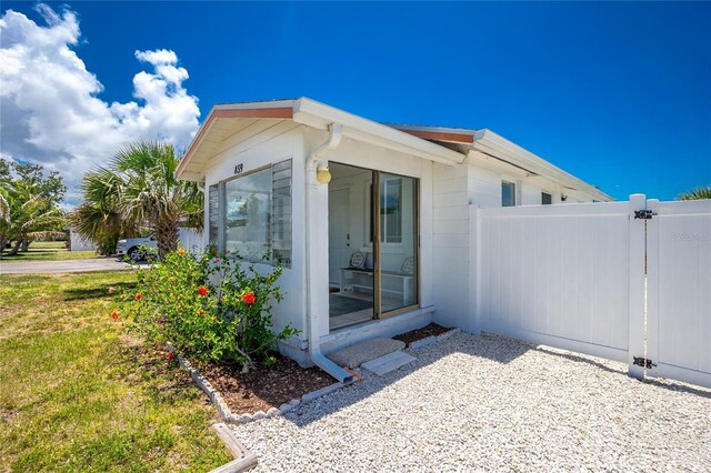 859 E 2nd St, Englewood, FL 34223 - view of side of home with a gate