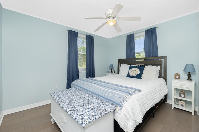 859 E 2nd St, Englewood, FL 34223 - bedroom with wood finished floors, multiple windows, baseboards, and crown molding