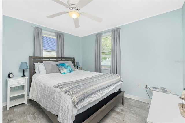 859 E 2nd St, Englewood, FL 34223 - bedroom with baseboards, wood finished floors, ornamental molding, and ceiling fan
