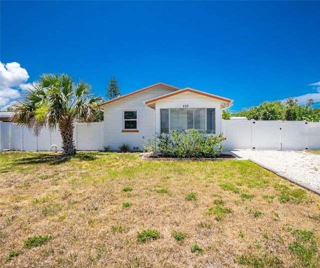 859 E 2nd St, Englewood, FL 34223 - view of front of house featuring a gate